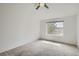 Bedroom with a ceiling fan and a bright window view at 6506 Silver Mesa Dr # F, Highlands Ranch, CO 80130