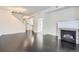 Bright living room featuring hardwood floors, a fireplace, and an open floor plan at 6506 Silver Mesa Dr # F, Highlands Ranch, CO 80130