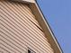 Light beige vinyl siding with roof damage near the gable at 9464 Newton St, Westminster, CO 80031