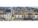 Aerial view of townhouses with mountain backdrop; showcasing community and landscape at 9656 Browns Peak Cir, Littleton, CO 80125