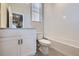 Clean bathroom with white vanity, toilet and bathtub at 9656 Browns Peak Cir, Littleton, CO 80125