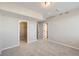 Bright bedroom with neutral walls, carpet, and walk-in closet at 9656 Browns Peak Cir, Littleton, CO 80125