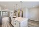 Modern kitchen with white cabinets, stainless steel appliances, and an island at 9656 Browns Peak Cir, Littleton, CO 80125