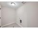 Simple laundry room with tile floor and utility hookups at 9656 Browns Peak Cir, Littleton, CO 80125