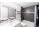 Modern bathroom with dark tile accent and white vanity and fixtures at 9925 W 20Th Ave # 2, Lakewood, CO 80215