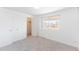 Cozy bedroom featuring carpet, closet, and scenic view from a large window at 9925 W 20Th Ave # 2, Lakewood, CO 80215
