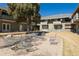 Community space with an outdoor seating area beneath mature trees at 9925 W 20Th Ave # 2, Lakewood, CO 80215
