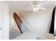 Entryway featuring tile flooring, carpeted stairs, and a ceiling fan at 9925 W 20Th Ave # 2, Lakewood, CO 80215