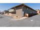 Apartment building exterior showing brick and siding with a parking area and landscape at 9925 W 20Th Ave # 2, Lakewood, CO 80215