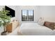 Relaxing bedroom showcasing modern furnishing, large black frame windows and minimalist decor at 1001 S Adams St, Denver, CO 80209