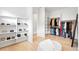 A large walk-in closet offering plenty of room for storage including shelving and hanging racks at 1001 S Adams St, Denver, CO 80209