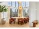 Sun-filled dining area features large windows and seating for eight at 1001 S Adams St, Denver, CO 80209
