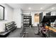 Well-equipped home gym with weights, punching bag, and stationary bike for a complete workout at 1001 S Adams St, Denver, CO 80209