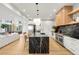 Gourmet kitchen with oversized island, custom cabinetry, and high-end appliances at 1001 S Adams St, Denver, CO 80209