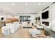 Open-concept living room with white brick fireplace and modern furnishings at 1001 S Adams St, Denver, CO 80209