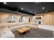 Spacious rec room with a large sectional sofa, bar area, and a fun playhouse feature at 1001 S Adams St, Denver, CO 80209