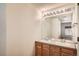 Bathroom featuring a double sink vanity with ample lighting and a large mirror, providing a bright and functional space at 4385 S Balsam St # 6-103, Littleton, CO 80123