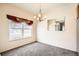 Bright dining room featuring a modern chandelier, large window with decorative valance and a large mirror at 4385 S Balsam St # 6-103, Littleton, CO 80123