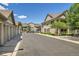Community street view with garages and condo buildings, showcasing a well-kept neighborhood at 4385 S Balsam St # 6-103, Littleton, CO 80123
