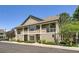 Well-maintained condo exterior featuring stone accents and private balcony at 4385 S Balsam St # 6-103, Littleton, CO 80123