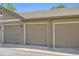 Attached garages featuring neutral paint and well-manicured surroundings at 4385 S Balsam St # 6-103, Littleton, CO 80123