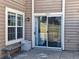 Cozy outdoor patio with bench seating and sliding glass door at 13504 E Asbury Dr, Aurora, CO 80014