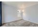 A serene bedroom with light blue walls and a plush, neutral-toned carpet at 13504 E Asbury Dr, Aurora, CO 80014