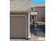 View of the home's exterior showing the garage, entry, and part of the landscaped yard at 13504 E Asbury Dr, Aurora, CO 80014