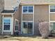 Exterior of home with sliding glass door to the backyard at 13504 E Asbury Dr, Aurora, CO 80014