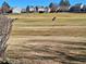 View of a golf course in the community on a sunny day at 13504 E Asbury Dr, Aurora, CO 80014