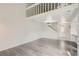 Spacious living room with light gray wood flooring and staircase to loft at 13504 E Asbury Dr, Aurora, CO 80014