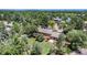 Aerial view of a home featuring a deck, a yard, and mature trees at 15 Pawnee Dr, Boulder, CO 80303