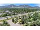 Scenic aerial view of the home near the mountains and highway at 15 Pawnee Dr, Boulder, CO 80303