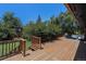 Large wooden back deck perfect for entertaining, featuring outdoor seating and lush tree surround at 15 Pawnee Dr, Boulder, CO 80303