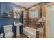 Stylish bathroom with unique tile work, modern fixtures, and a shower-tub combination at 15 Pawnee Dr, Boulder, CO 80303