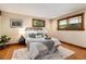 Comfortable bedroom with hardwood floors, large windows and neutral decor at 15 Pawnee Dr, Boulder, CO 80303