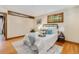 Bedroom featuring hardwood floors, large windows and neutral decor at 15 Pawnee Dr, Boulder, CO 80303