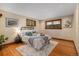 Charming bedroom featuring hardwood floors, wood framed windows, and neutral decor at 15 Pawnee Dr, Boulder, CO 80303