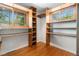 Walk-in closet with built-in shelving and hardwood floors at 15 Pawnee Dr, Boulder, CO 80303