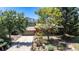 Charming home with a spacious driveway, a two-car garage, colorful landscaping, and mountain views at 15 Pawnee Dr, Boulder, CO 80303