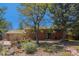 Charming brick home with well-maintained front yard featuring colorful landscaping at 15 Pawnee Dr, Boulder, CO 80303