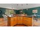 Kitchen island features granite countertops, custom cabinets, pendant lighting, and seating at 15 Pawnee Dr, Boulder, CO 80303
