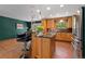 Eat-in kitchen with wood cabinetry, granite countertops, stainless steel appliances, and pendant lighting at 15 Pawnee Dr, Boulder, CO 80303