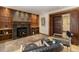 Charming living room with a wood-burning stove, built-in shelving, and comfortable seating at 15 Pawnee Dr, Boulder, CO 80303