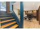 Inviting living room featuring stylish decor, staircase, and a wood-burning fireplace at 15 Pawnee Dr, Boulder, CO 80303