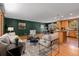 Inviting living room with wood floors adjacent to an open kitchen and dining area at 15 Pawnee Dr, Boulder, CO 80303