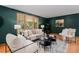 Inviting living room with large window, hardwood floors and comfortable seating at 15 Pawnee Dr, Boulder, CO 80303