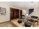 Inviting living area with built-in bookshelves, hardwood floors, and comfortable seating at 15 Pawnee Dr, Boulder, CO 80303