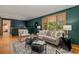 Comfortable living room with large window, hardwood floors, area rug and comfortable seating at 15 Pawnee Dr, Boulder, CO 80303