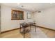 Well-lit office space with hardwood floors, a desk, and a view to the outdoors at 15 Pawnee Dr, Boulder, CO 80303